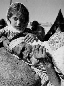 iconic image of girl comforting old man during 1948 "Nakba"